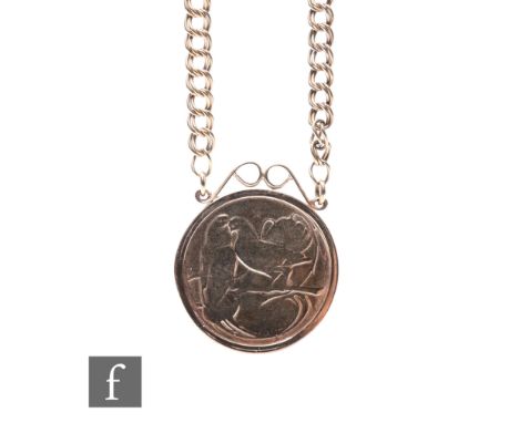 A 9ct circular medallion decorated with turtle doves and suspended from a 9ct double belcher link chain, total weight 29.5g.