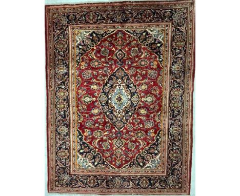 A 20th century Central Persian Islamic Kashan floor rug carpet having a central medallion in light blue &amp; cobalt within a