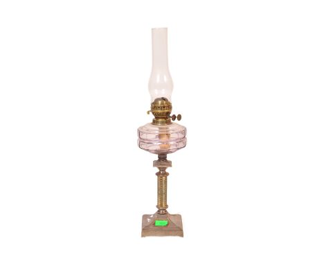 A 19th Century brass and metal oil lamp light. With glass flute shade to top, clear purple&nbsp;reservoir chamber with a cent