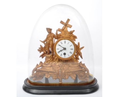 19th century French gilt metal 24hour mantel clock with glass dome. The gilt metal clock with boy and windmill over brass 24h