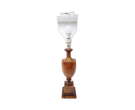 A mid 20th Century amber onyx style table lamp light. With a flared floral rim tapering neck into a round tapering body, a to