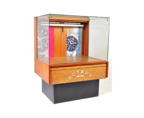 Rotary - A retro 20th Century shop display / advertising glass and teak veneered cabinet / counter of square form with glazed