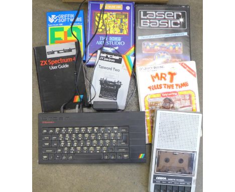 A Sinclair ZX Spectrum+ console, printer module, tape recorder and games 