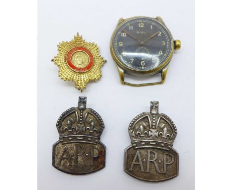 Two silver ARP badges, a silver Golden Jubilee badge and an Aristo black dial wristwatch 