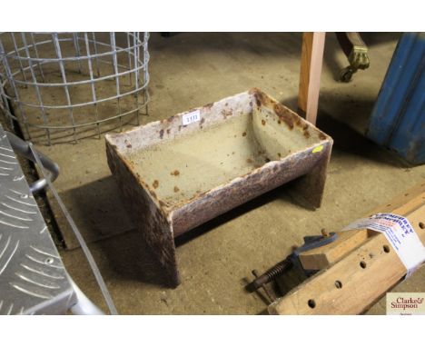 A cast iron feed trough AF