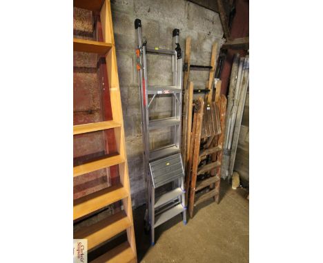 A metal five step folding combination ladder and a metal folding three step set of steps 