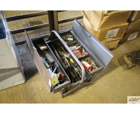 A metal cantilever tool box and quantity of tools, fixings and spares