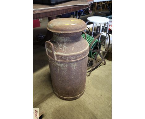 A vintage twin handled milk churn