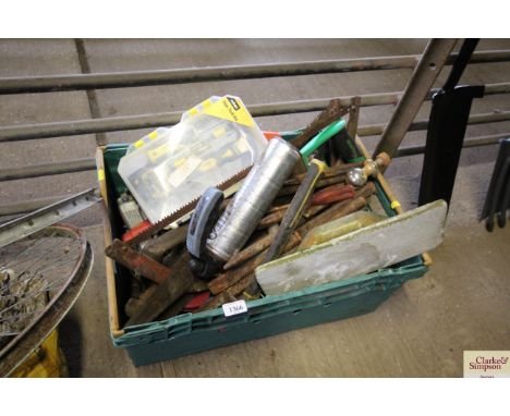 A plastic tray box containing various garden and builders tools