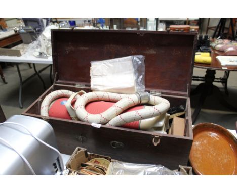 A vintage Electrolux vacuum cleaner in wooden fitted case, sold as collectors item
