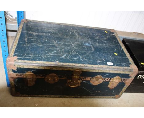 A metal bound travelling trunk