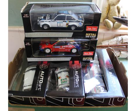 Five boxed large scale rally cars