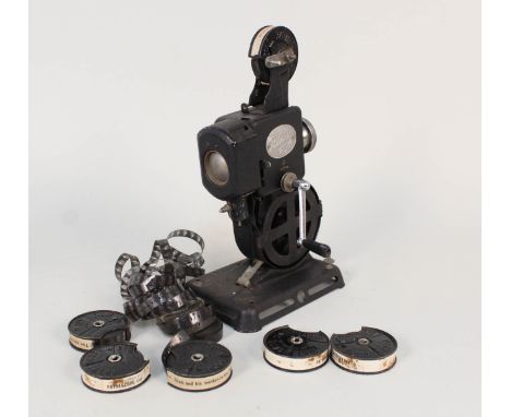 A Pathe kid projector and films including The Extraction of Coal and Snub and His Mother in Law