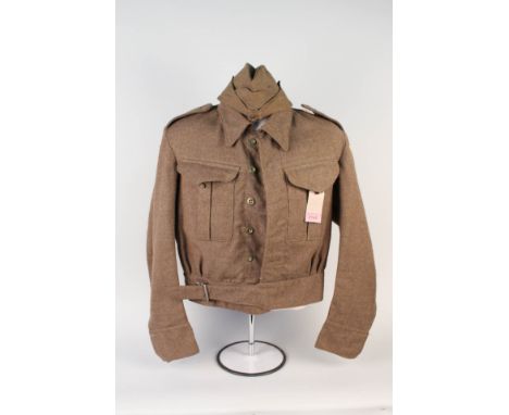 A 1940 patt battle dress blouse dated Feb 1944 with Home Guard shoulder titles and SFK8 arm insignia (Suffolk Home Guard Peas