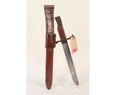 A Canadian model 1907 MkI Ross bayonet with correct leather scabbard and frog, overall a good clean example