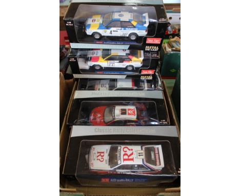 Five boxed large scale rally cars