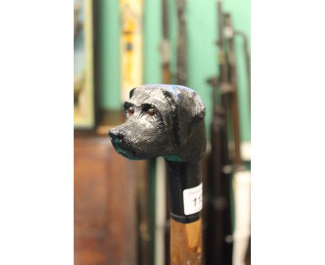 A bespoke hand crafted walking stick with dogs head