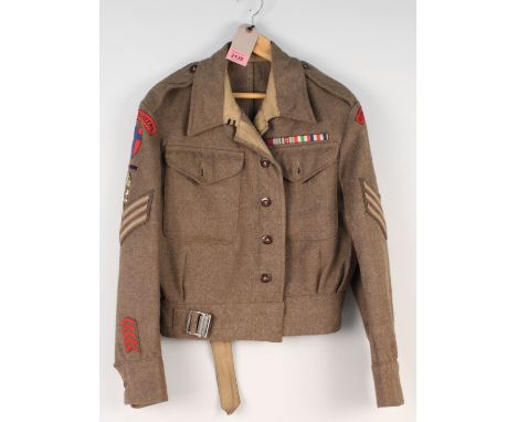A 1940 patt battle dress blouse dated 1942 complete with Royal Engineers insignia, a very fine example