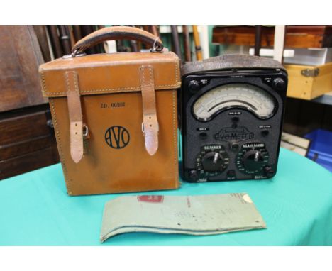 A cased avometer with instruction book and marked with broad arrow
