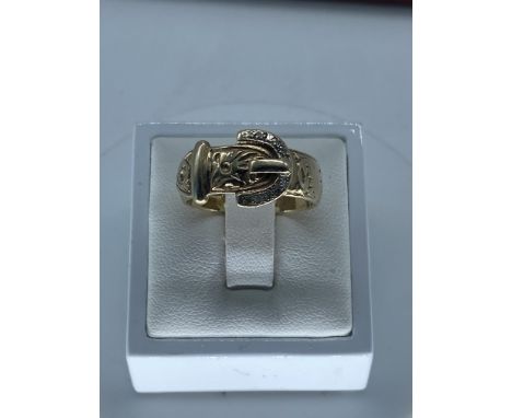 A 9ct yellow gold diamond stone set buckle ring,nice solid thick shank,size R (leading edge),weight is 6.1 grams approx