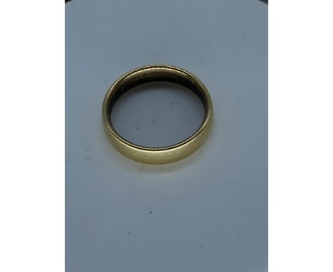 A large 18ct yellow gold wedding band,7.4 grams in weight approx,4.5mm wide,size R,fully hallmarked