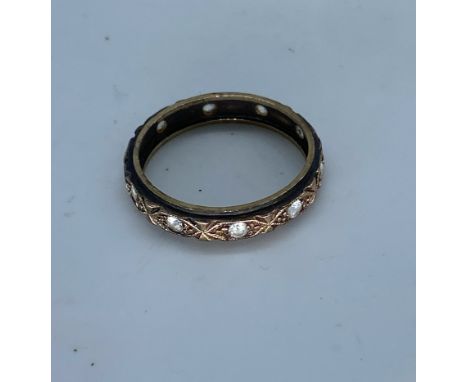 A 9ct yellow gold Vintage cz stone set wedding band,size O 1/2,weight 2.4 grams approx,hallmarked 9ct,no stones missing