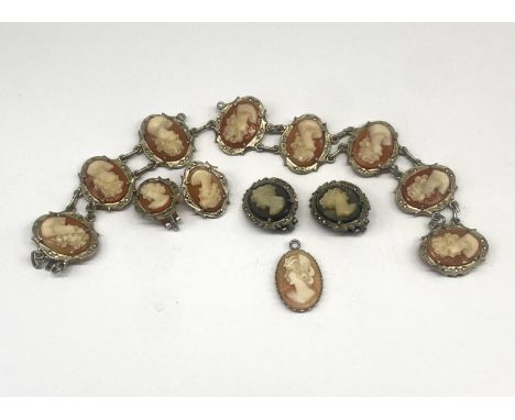 A silver vintage Cameo bracelet & a pair of earrings,bracelet & 2 pairs of earrings are hallmarked 800,the pendant is a base 