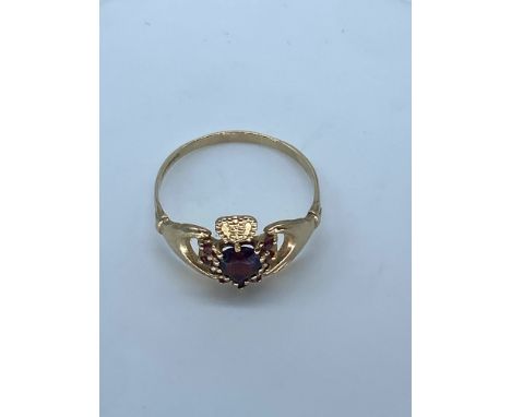 A 9ct yellow gold garnet Clada ring,size R,weight is 2 grams approx
