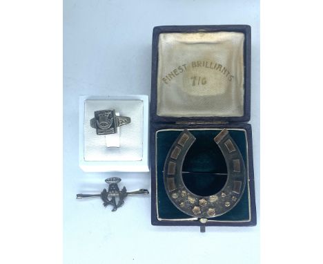 A mixed lot of vintage silver,Scottish Iona silver ring,large silver & gold lucky charm brooch,a Scottish thistle brooch & a 