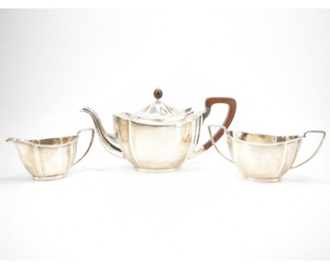 A 19th Century hallmarked silver three piece tea set. The service having serpentine form &amp; reeded rims to the bowl &amp; 