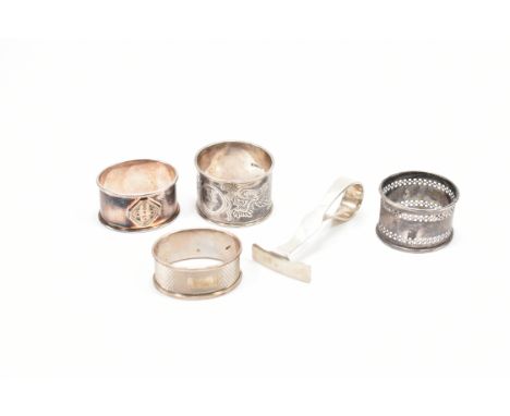 A collection of hallmarked silver napkin rings & pusher. The lot to include; one pierced decoration (hallmarked for Birmingha