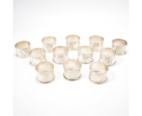 A set of twelve 20th Century Brunei South East Asian silver napkin rings. The napkin rings each having engraved detailing of 
