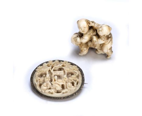 Ivory netsuke of three playful childrenJapanese, late Meiji periodCondition report: At present, there is no condition report 