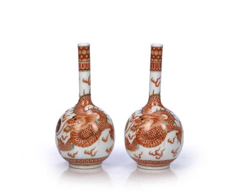 Pair of bottle vasesChinese, 20th Centurydecorated with dragons chasing the flaming pearl, with six character Kangxi mark to 