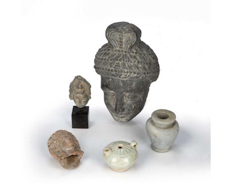 Group of small itemsChineseto include a stone head of Bodhisattva, 5.5cm across, two small heads of deities, a celadon teapot