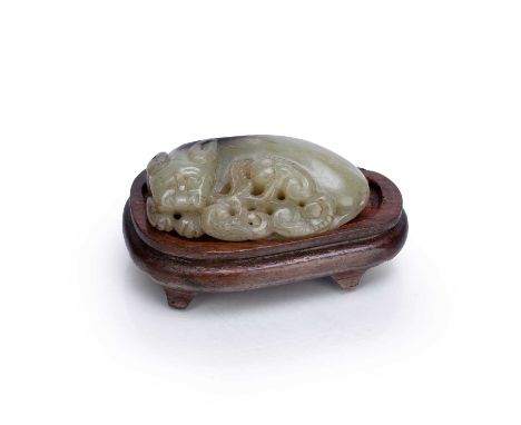 Carved jade model of a LionChinesein a recumbent pose, with a fitted stand, 7cm acrossCondition report: Natural wear and impe