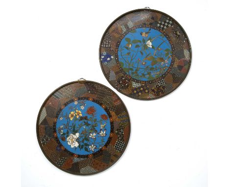 Pair of cloisonne wall plaquesJapanese, late 19th Centuryfinely inlaid with central birds and blossom, within a panelled geom