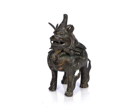 Bronze censerChinese, Ming periodin the form of a Luduan, the head tilting for use as a storage vessel, 12cm highCondition re