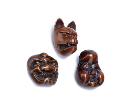 Wood netsukeJapanese, 19th Centuryof a snarling Kitsune (fox), a wood netsuke of a well expressed Okame, signed, and another 
