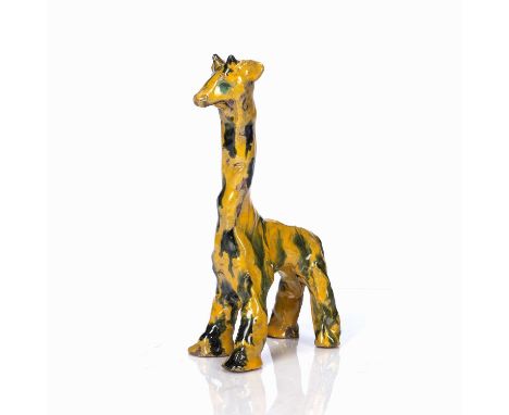 Channakle model of a camelTurkey, early 20th Centurywith splash ware glaze, standing on four legs, painted in yellow and gree