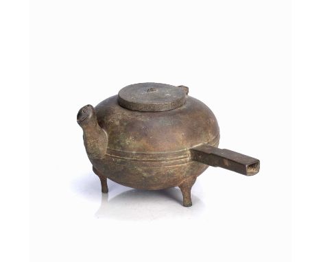 Side handled bronze vesselChinese, Han dynastyof plain reeded form, with hinged lid and spout and on three short feet, 26cm l