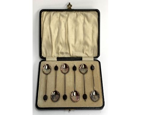 A cased set of six George V silver and guilloche enamel bean terminal coffee spoons, William Suckling Ltd, Birmingham 1928 