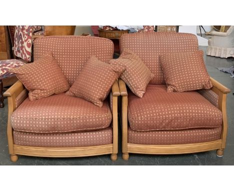 A pair of contemporary Ercol light oak armchairs, upholstered in a small check fabric, approx. 90cmW 