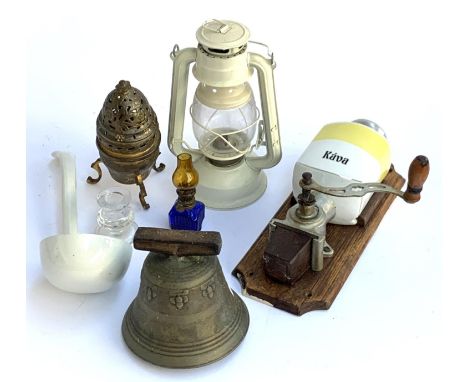 A wall mounted European vintage coffee grinder; brass bell; oil lamp; ceramic ladle etc 