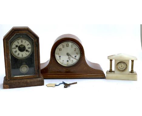 A mahogany cased domed mantel clock, striking on a chime, 45cmW; a further mantel clock; and a marble and gilt metal portico 