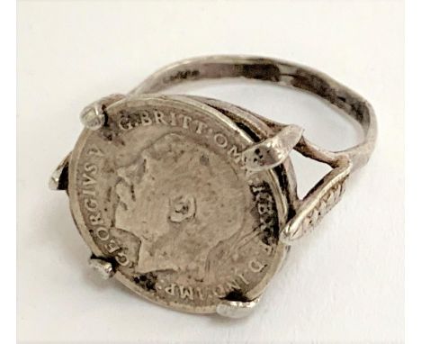 A silver ring set with a 1911 George V maundy threepence, size L 