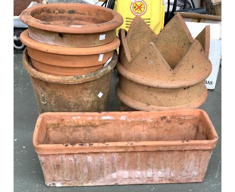 Three large terracotta plant pots, each approx. 33cmD; together with a chimney and a terracotta trough 50cmW 