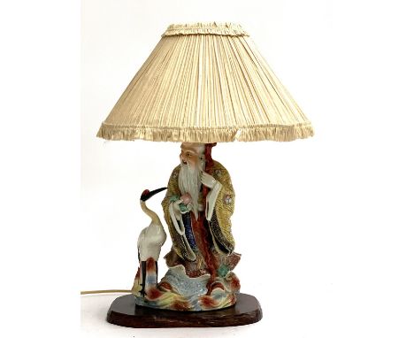 A Chinese ceramic table lamp of an immortal with a stork, height including shade 50cmH 