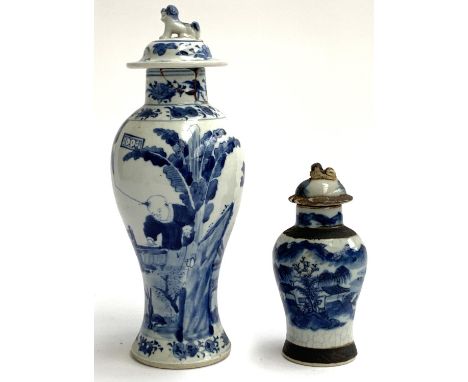 A Chinese Kangxi style vase with foo dog cover (af), marks to base, 31cmH including lid; together with one smaller crackle gl