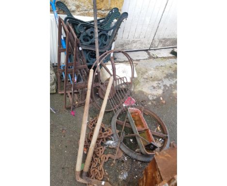 A mixed lot of cast iron and other items to include 2 pairs of bench ends, a shepherd's hut wheel, heavy towing chain with ho